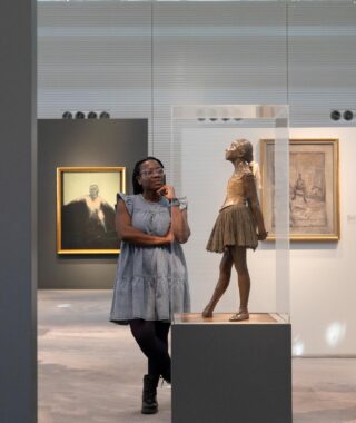 A visitor looking at a sculpture in an art gallery Sainsbury Centre Nowich